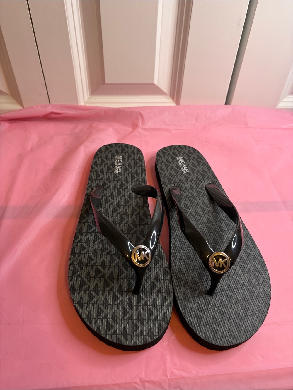 Michael Kors Black Flip Sandals with Gold MK Medallions